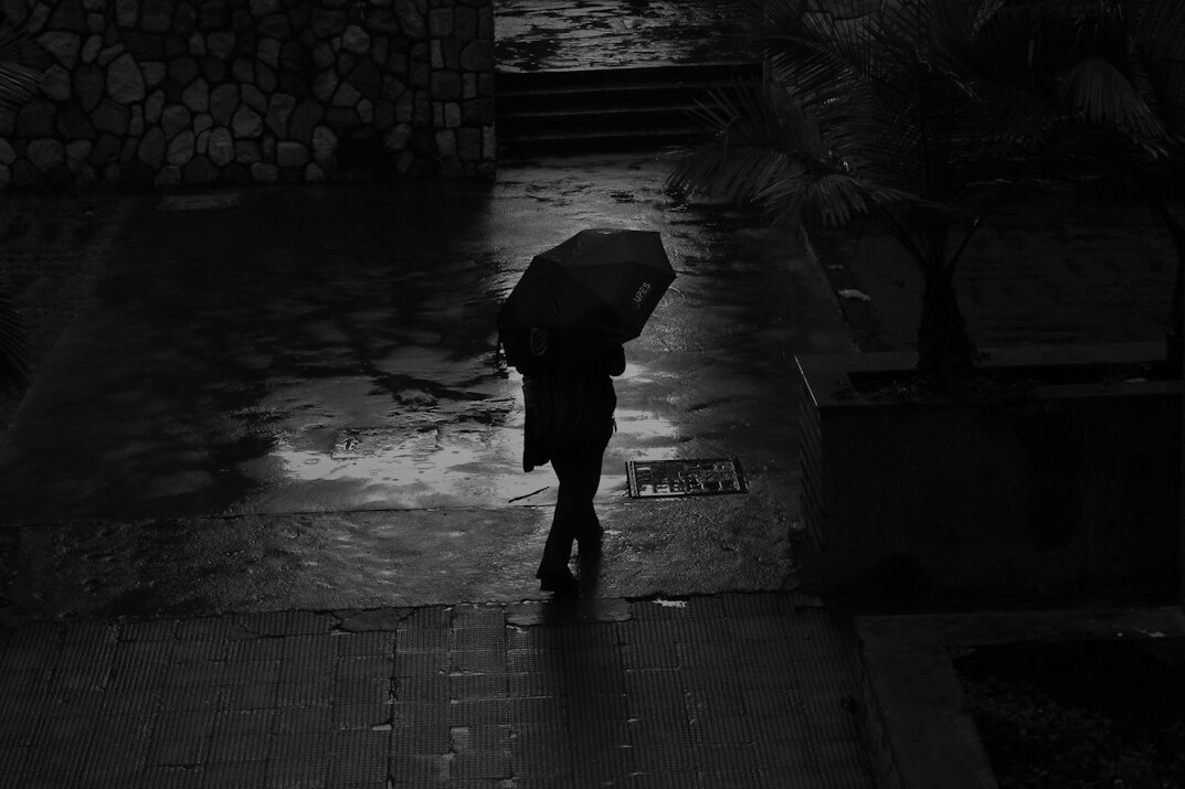 mysterious detective in rain